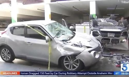 Xe BMW lao từ tầng ba xuống đất